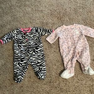 Two Carter’s newborn footie pajamas